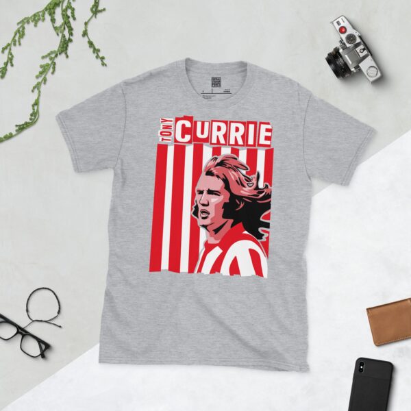 A versatile sports grey T-shirt showcasing a dynamic illustration of Tony Currie, the beloved Sheffield United midfielder. The design includes his portrait over a bold red and white striped pattern, with his name clearly visible.