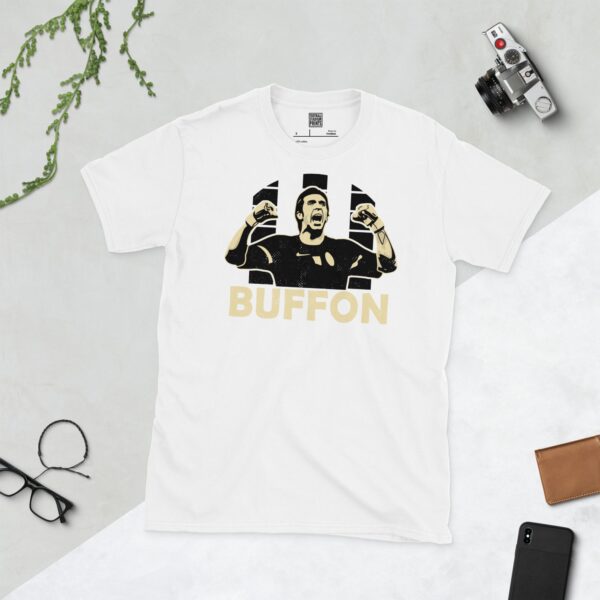 A clean white T-shirt featuring a stylised graphic of Juventus legend Gianluigi Buffon celebrating, set against a vibrant sunburst background of black and white stripes. His surname "BUFFON" is prominently displayed below the portrait.