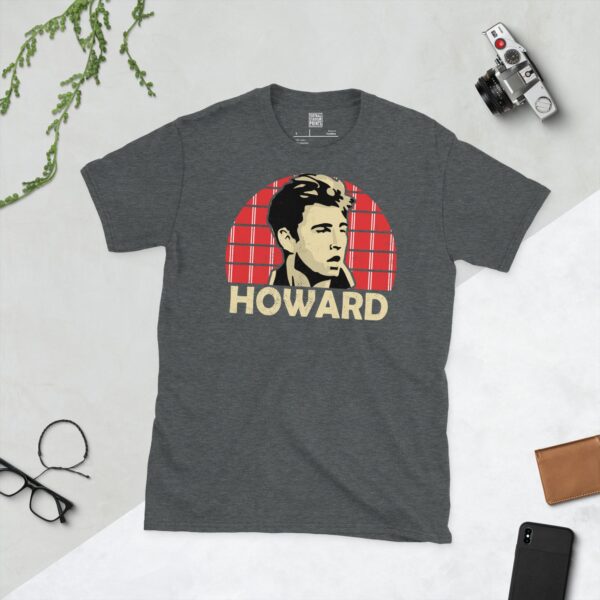 A subtle dark heather T-shirt displaying a distinctive graphic of former Leyton Orient maestro Terry Howard. His portrait is captured against a retro red and white pinstriped sunburst effect, with his surname "HOWARD" directly beneath the illustration.