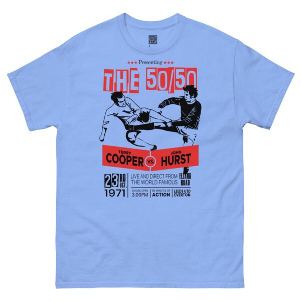 A Carolina blue T-shirt featuring a boxing-style poster graphic. The design shows two footballers, one in white (Leeds United) and one in blue (Everton), locked in a 50/50 challenge during a match. The text "LEEDS v EVERTON 1971" is printed above the players.