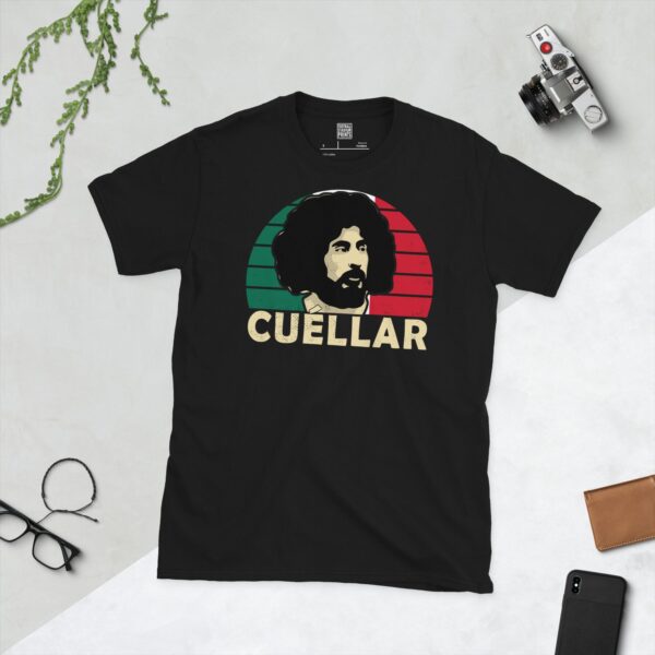 A black T-shirt featuring a stylised graphic of Mexico legend Leonardo Cuellar's portrait, set against a green, white, and red striped sunburst background. The name "CUELLAR" is printed in light yellow below the portrait.