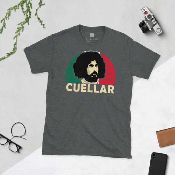 A dark heather T-shirt showing a clean, modern portrait of Leonardo Cuellar, the Mexico icon, with "CUELLAR" printed in light yellow below the image on a green, white, and red sunburst background.