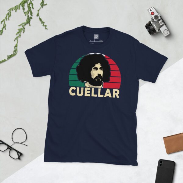 A navy T-shirt displaying an artistic illustration of Leonardo Cuellar, the former Mexico midfielder. The graphic is backed by a red and green sunburst and the name "CUELLAR" appears underneath in light yellow.
