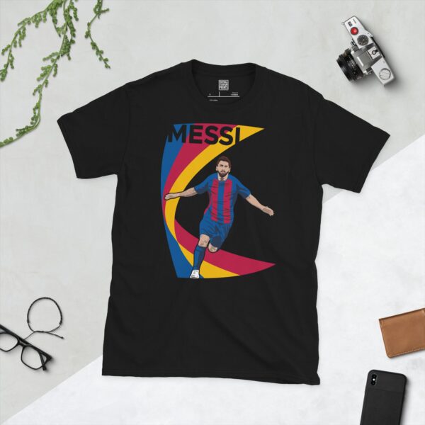 A black T-shirt featuring a graphic of Lionel Messi running in a red and blue kit, set against a dynamic, swooping graphic in red, blue, and yellow. The name "MESSI" is printed above the image.