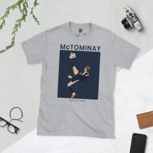 A sports grey T-shirt featuring a unique graphic of Scott McTominay scoring the spectacular overhead kick for Scotland.