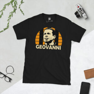 A black T-shirt featuring a stylised, distressed graphic of Hull City legend Geovanni. The portrait is backed by an amber and black striped sunburst, with the name "GEOVANNI" printed in light yellow below.