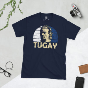 A navy T-shirt displaying an artistic illustration of Tugay. The graphic features a blue and white sunburst background and the name "TUGAY" appears underneath.