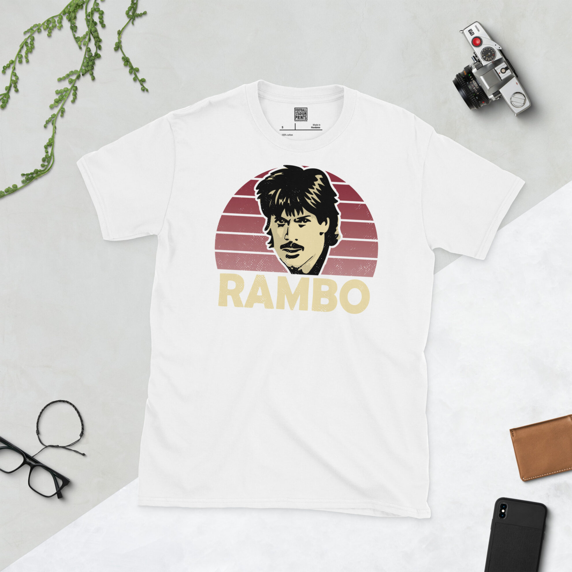 A clean white T-shirt with a high-definition distressed print of Northampton Town icon Graham Reed against a claret sunburst.