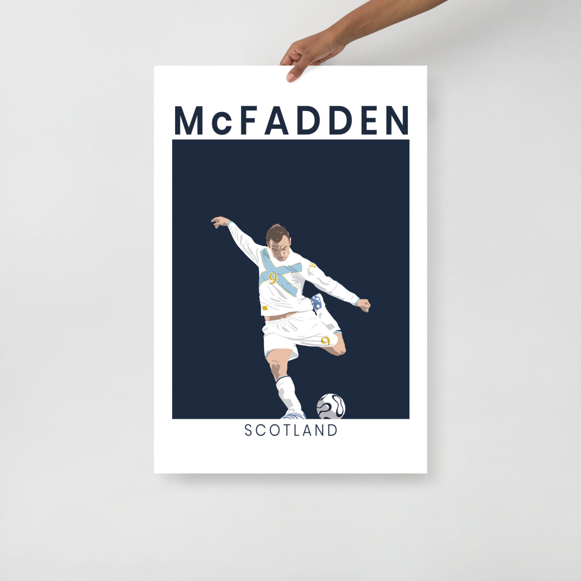 A minimalist art print of James McFadden striking the ball in his white and saltire-blue Scotland away kit against France in Paris.