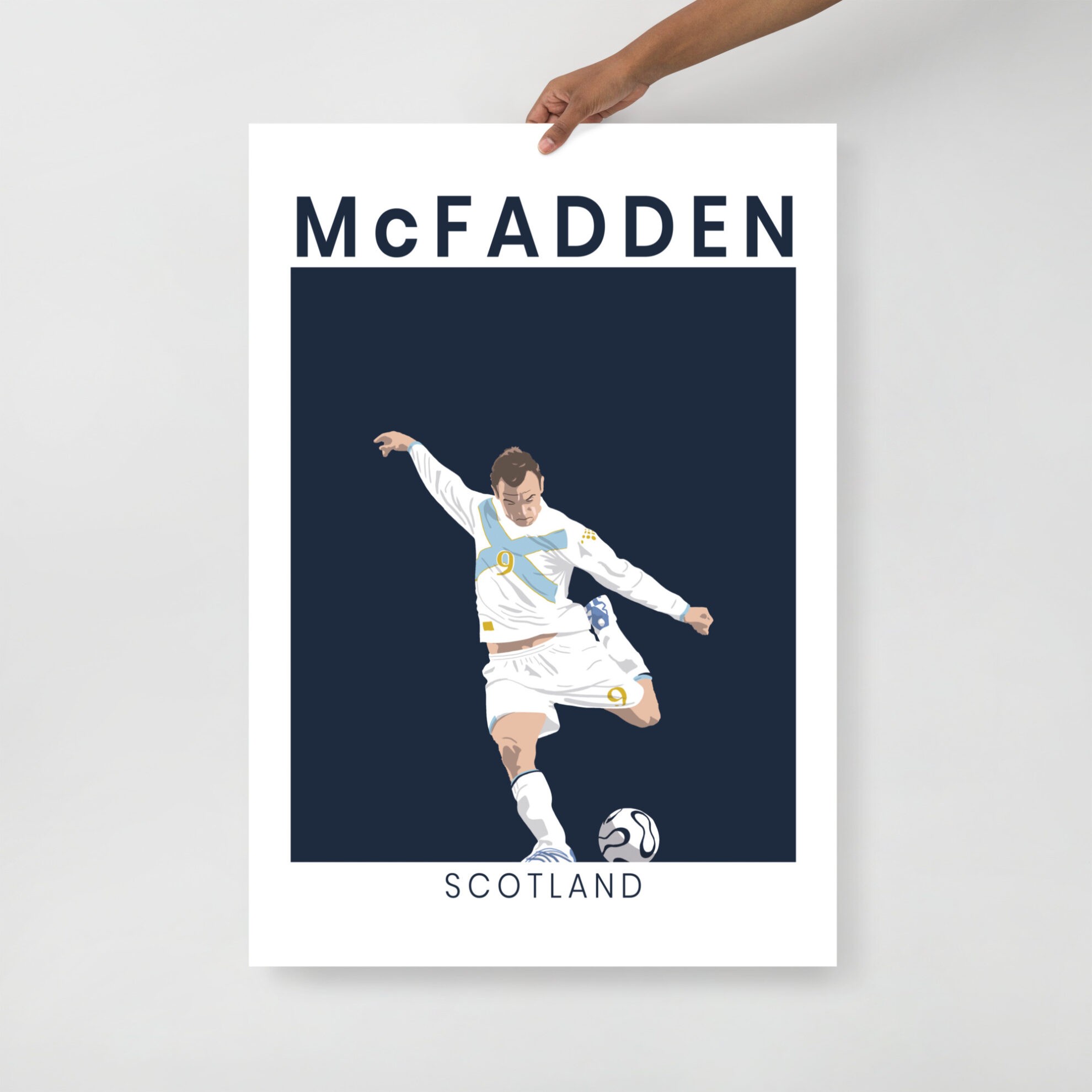A minimalist art print of James McFadden striking the ball in his white and saltire-blue Scotland away kit against France in Paris.