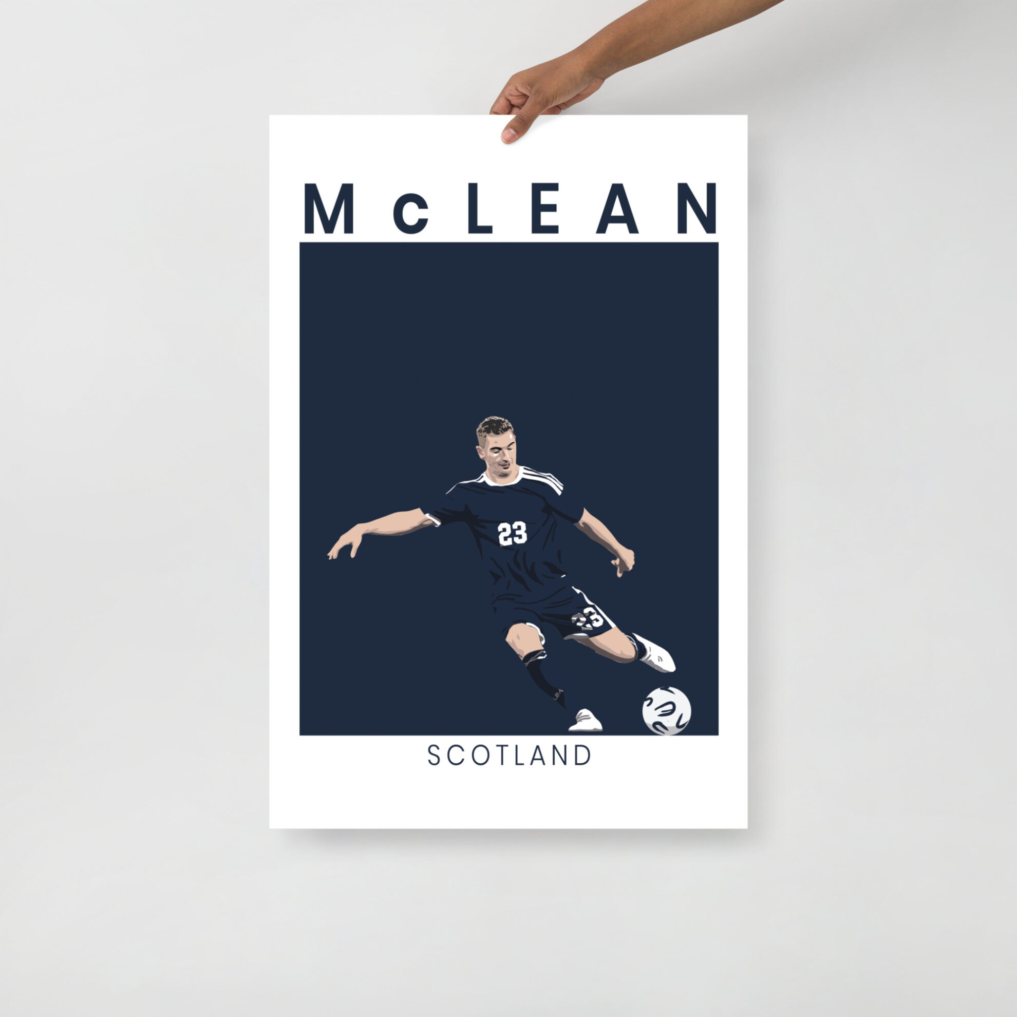 A stylised art print of Kenny McLean in a goal-scoring pose for Scotland against Denmark, featuring a minimalist navy and white design.