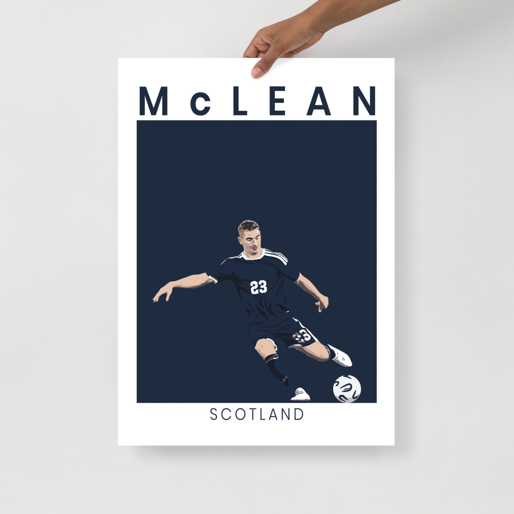 A stylised art print of Kenny McLean in a goal-scoring pose for Scotland against Denmark, featuring a minimalist navy and white design.