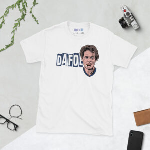 A clean white T-shirt featuring the "DAFOE" graphic, depicting the legendary actor in a high-contrast, stylised design.