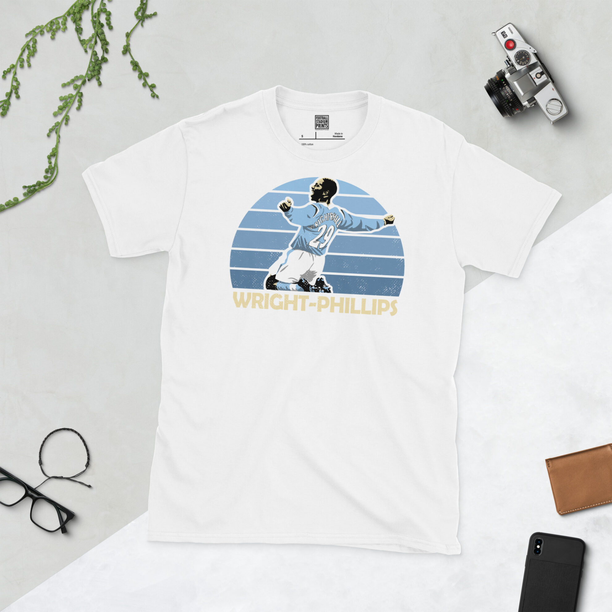 A clean white T-shirt featuring a high-definition distressed print of Manchester City hero Shaun Wright-Phillips celebrating a goal.