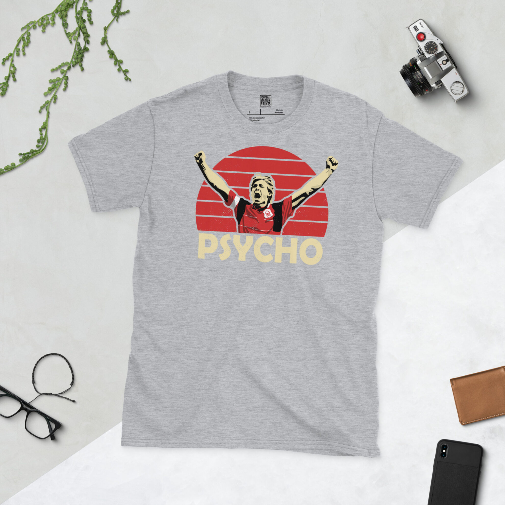 A sports grey T-shirt with a bold red sunburst design of Stuart Pearce, titled with his famous nickname in a block font.
