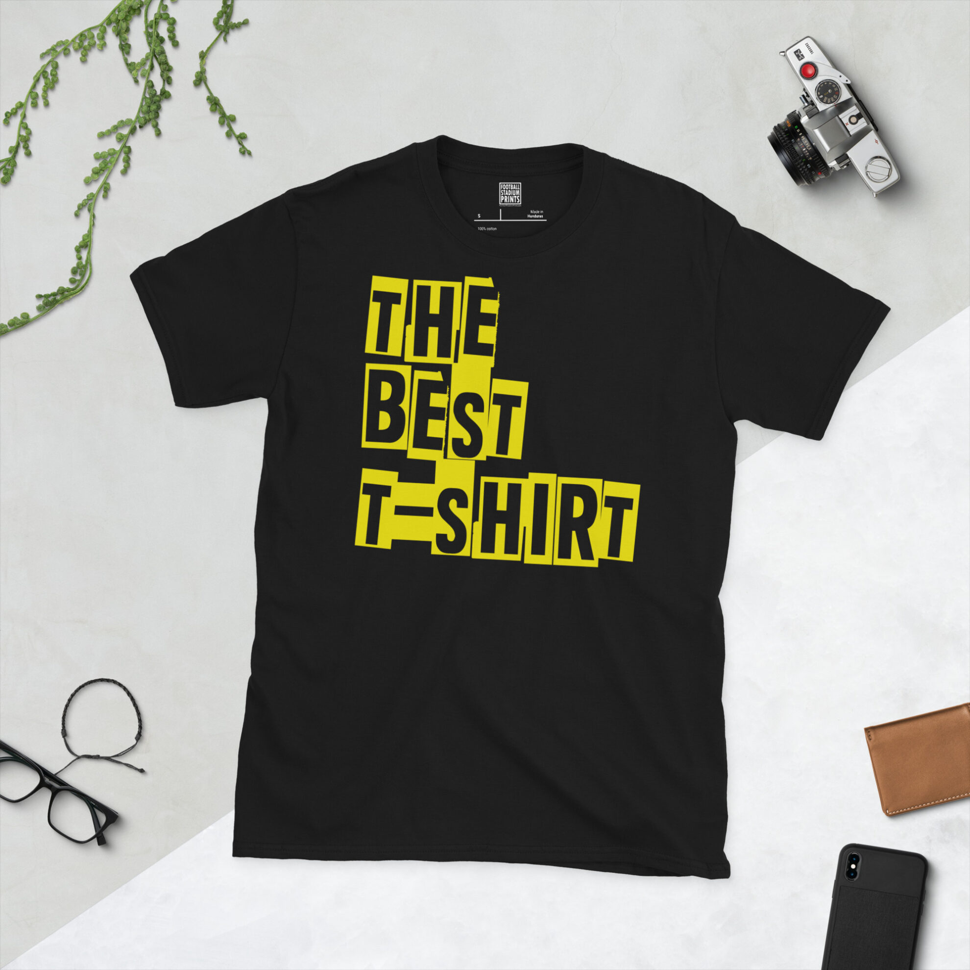 Front view of a black crew neck graphic tee printed with 'The Best T-Shirt' in bold typography.