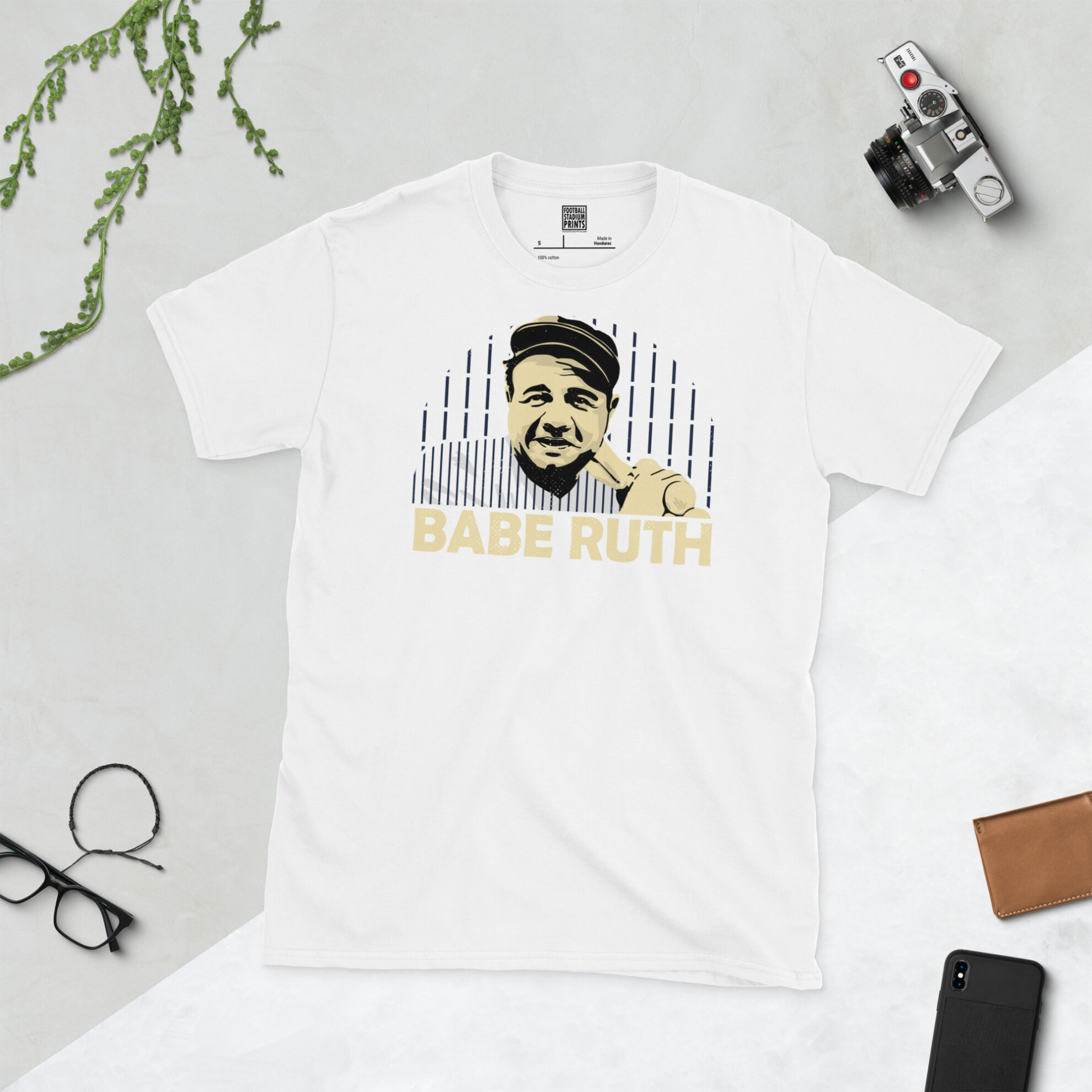 A clean white T-shirt featuring a high-definition distressed print of MLB legend Babe Ruth in iconic New York Yankees pinstripes.