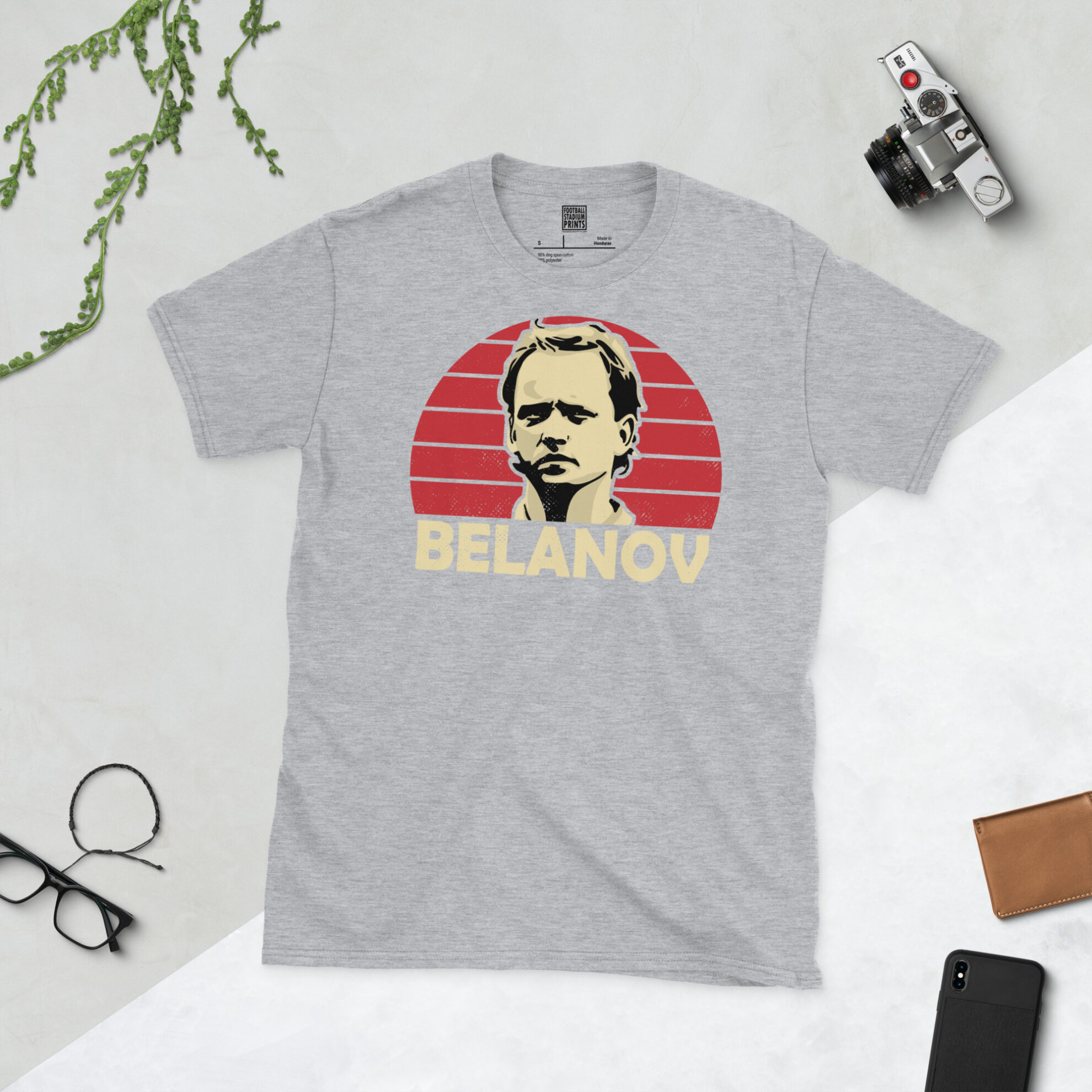 A sports grey T-shirt featuring a bold red sunburst design of Igor Belanov, finished with his surname in a classic retro font.